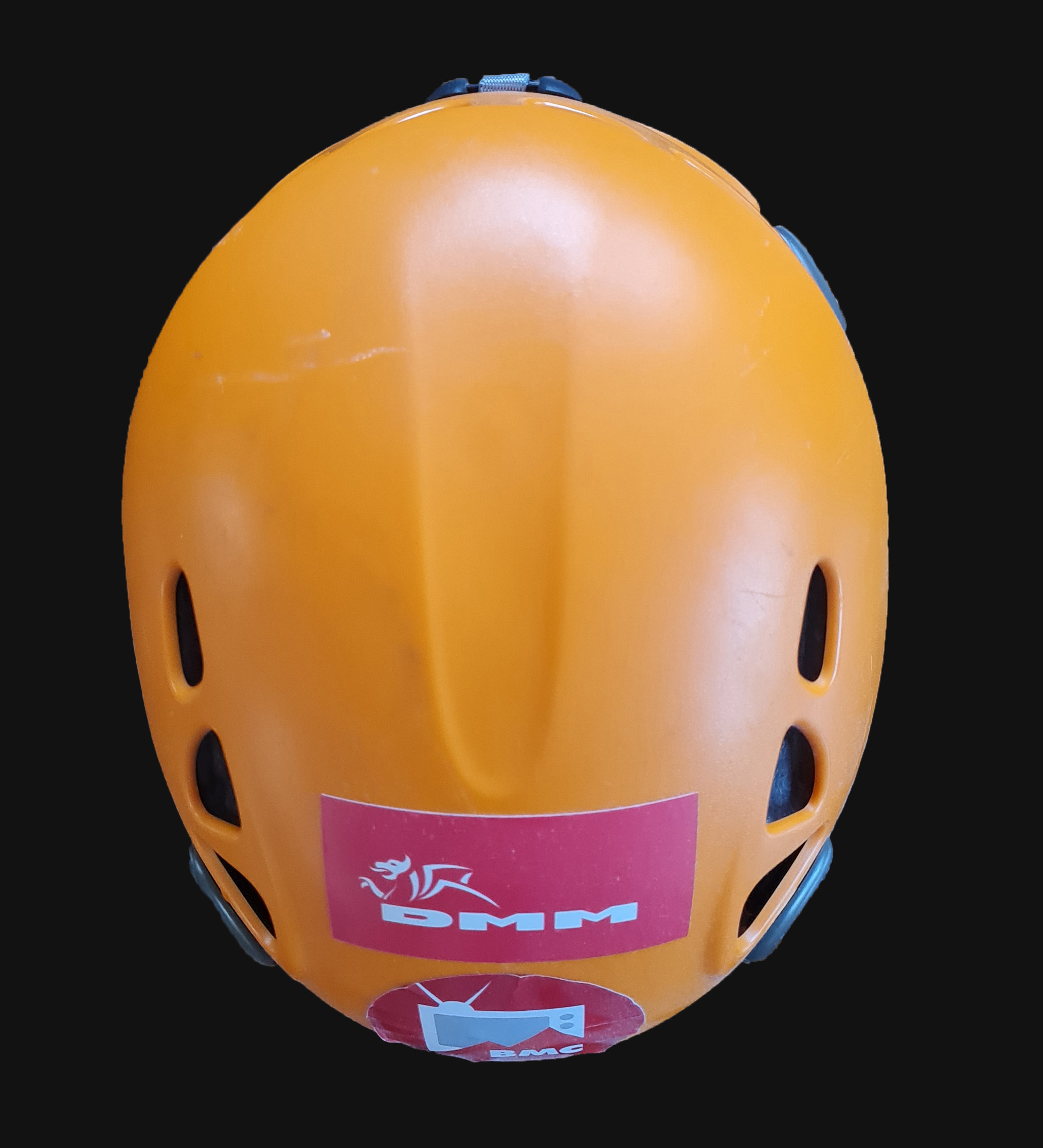 An orange climbing helmet